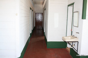 The long hallway leads to the bedrooms and bathrooms.