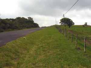 The paved highway continues past the finca over the hilltop to the village of Tierras Morenas.