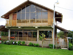 This glassy 2-story house is one of four habitations on the finca. 