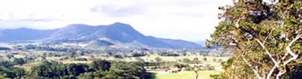 Miravalles Volcano rises above a plain and rolling hills in the temperate zone above the town of Bagaces on the Interamerican Highway.