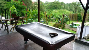 The common areas provide plenty of room for socializing and entertainment such as this pool table patio.