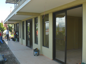 The glass doors and windows have been completely installed in the commercial spaces.