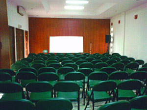 A cond confrnce room is filled with a hundred chairs. 