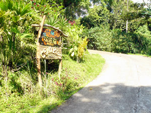 Entrance to the complex, thickly forested property is a concrete drive from the main lake highway between the dam and Nuevo Arenal.