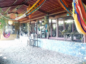 Leading to one of the cabins is this covered entertainment area or rancho where there are also a couple of large cages for rescued birds, including a toucan.