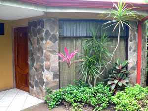 The modern cabinas or bungalows have solid block construction with large windows and stone facing on exterior walls.