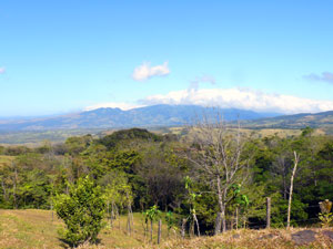 Another northern volcano, Miravalles, is partially seen in this shot, the major part hidden by the clouds it creates locally. 