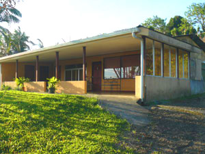 The motel is set pleasantly above the highway amid greenery and fields.