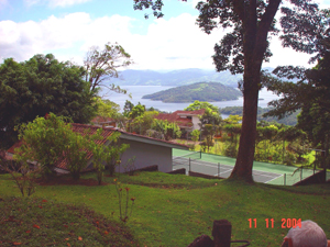 The fine 20x40 tennis court is between the main house and the bigger guest house.