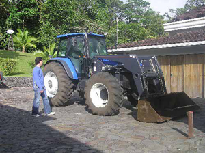 This top-of-the-line galss-cab Ford tractor/loader is included