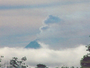 Arenal Volcano adds its own steam to the clouds.