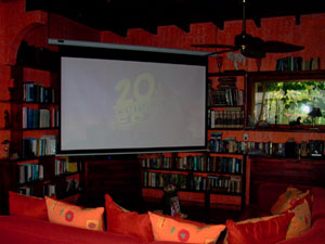 The comfortable library is sometimes the site of films projected on a large portable screen.