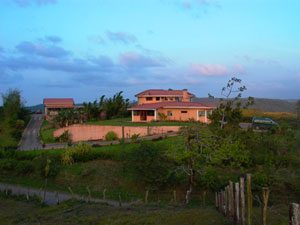 The Inn occupies the center of the photo while the owner's residence is at far left.