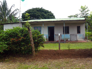 Solar panels supply electricity to the small Tico home.