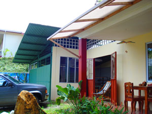 First is the front of the restaurant and store, then is the building now being used for crafts manufacture. On the high bank beyond is the rental house. 