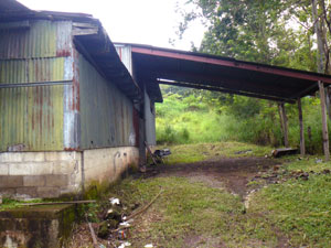 The long east side of the building has a very large covered "truckport" for whether-protected loading.