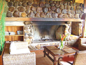 The great rock fireplace in one of the comfortably furnished common areas