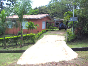 The two homes are on a cul-de-sac in a pretty setting with a concrete drieway.