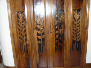 Custom woodwork by Arenal artisans enriches the home.