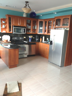 The fully outfitted kitchen has fine custom hardwood cabinetry.