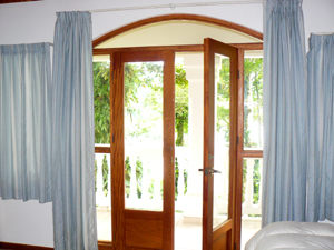 Large lakeview windows and handsome French doors brighten the master suite and provide beautiful views.