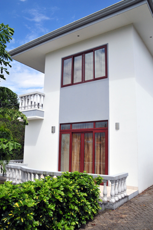 The European features include German windows and doors such as these leading to a first-floor patio.