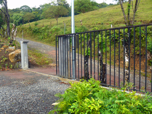 The property has a remote controlled electric gate opening onto the road to La Preserve gated community.