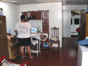 There's a large laundry area in the foot of the L and the entry from the carport. 