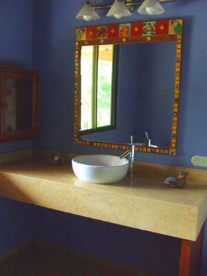 The master bathroom is colorful and modernistic.