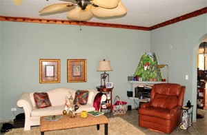 Another arched doorway leads to the kitchen and dining room.