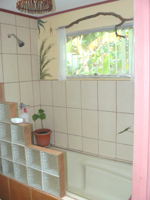 The master bathroom has a large tub as well as a shower.