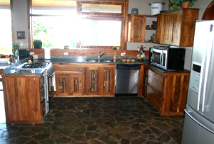 The kitchen has fine appliances including a dishwasher, granite counters, and a separate pantry.