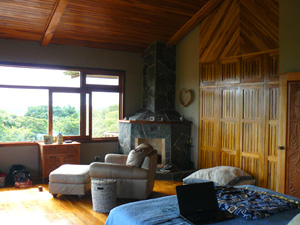 The master bedroom has a wood-burning fireplace identical to the one in the living room below.