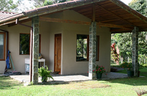 The guest house is privately set amid lovely landscaping and has lake and volcano views.