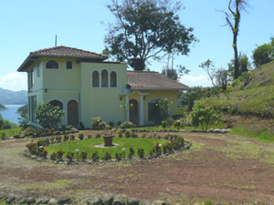 The home has a wonderful tropical atmosphere with fine lake and volcano views from both floors.