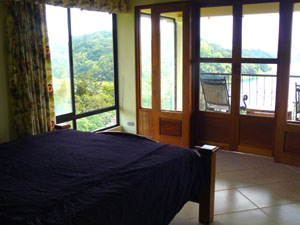 On the second floor, the master bedroom and balcony take advantage of the great lake and mountain vistas.