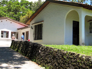 Behind the house is a small warehouse with a 2BR 1BA apartment.