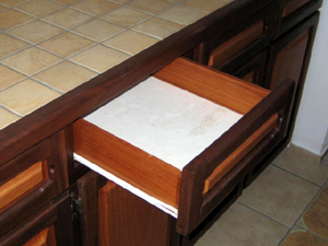 The kitchen features nice tile and custom hardwood cabinetry.