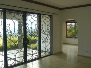 There's a formal dining room with large windows on two walls.