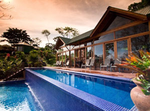 The large club house has a long infinity pool.