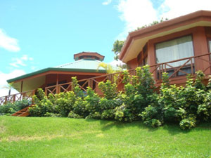 The new home and cottage have nice decks and abundant glass.