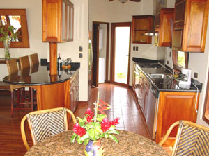 The kitchen has granite countertops and fine appliances.