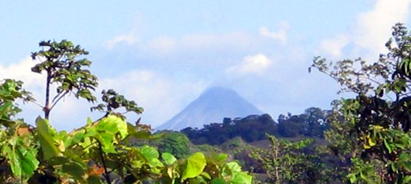 Perfect Arenal Volcano enraptures the southern vista.