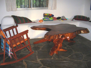 The living room table is of beautiful Guanacaste hardwood. 