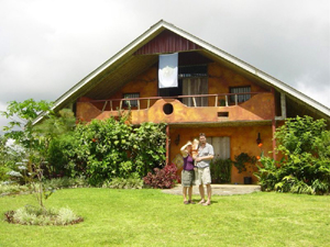 The creative owners in front of the home.