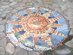 Mosaic sun was made onsite by local artists. 