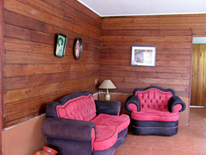 The cabina has warm wooden walls.