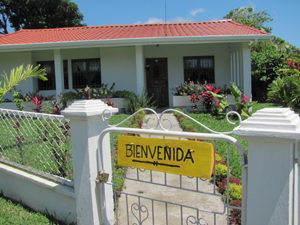 The home has a house-wide front veranda and a brand-new roof.