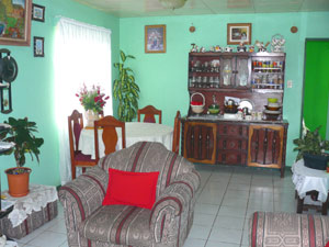 The combination front room and dining room is meticulously decorated and maintained. 