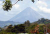 Arenal Volcano stands out spectacularly in this view from in front of this well placed property. 